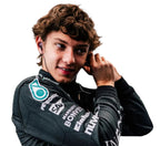 Endless Racegear 2025 Andrea Kimi Antonelli Mercedes replica suit worn by driver adjusting earpiece showing sponsor logos