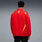 Red zip-up team jacket on model from back, Ferrari shield with yellow accents